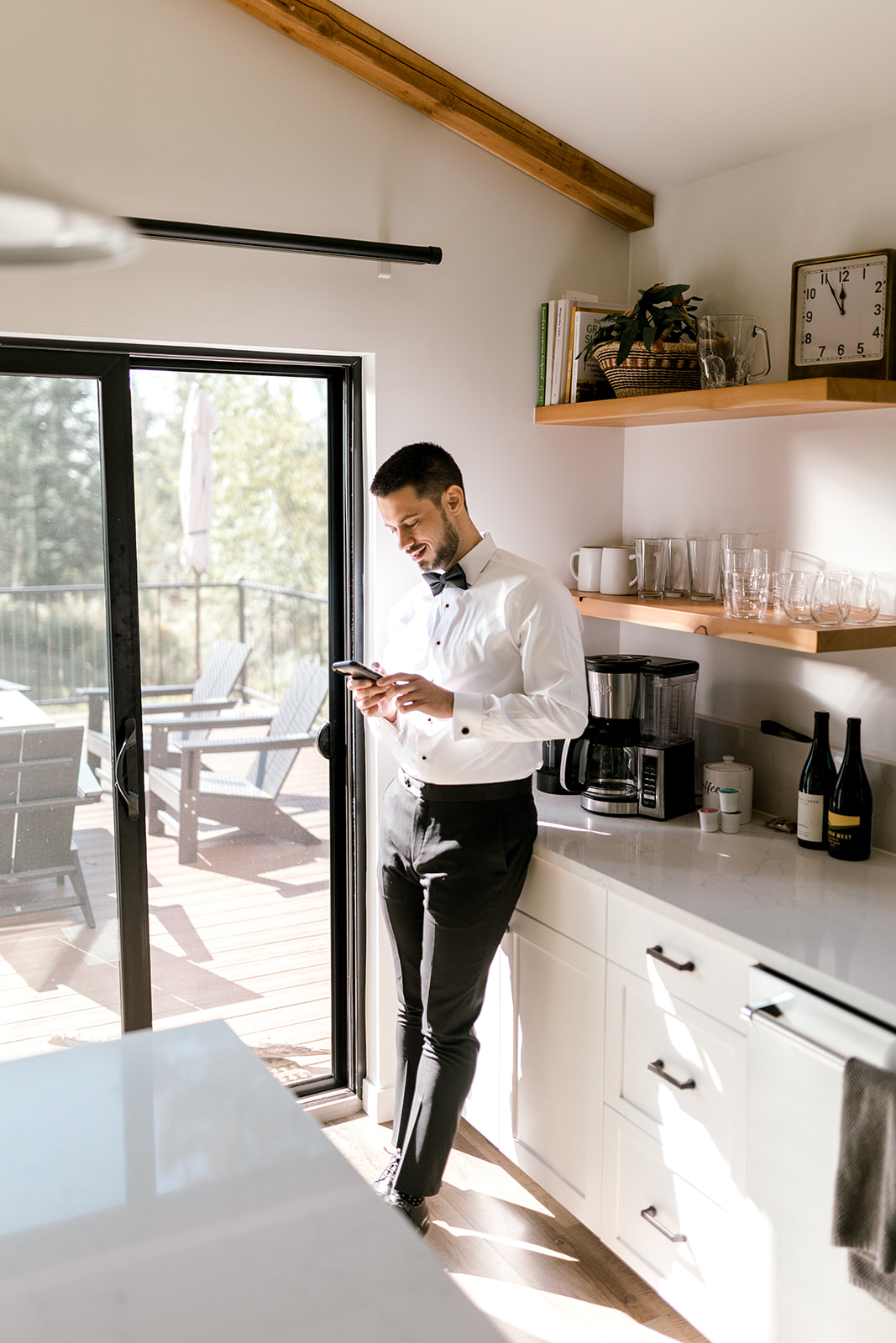 Groom relaxing in the kitchen
