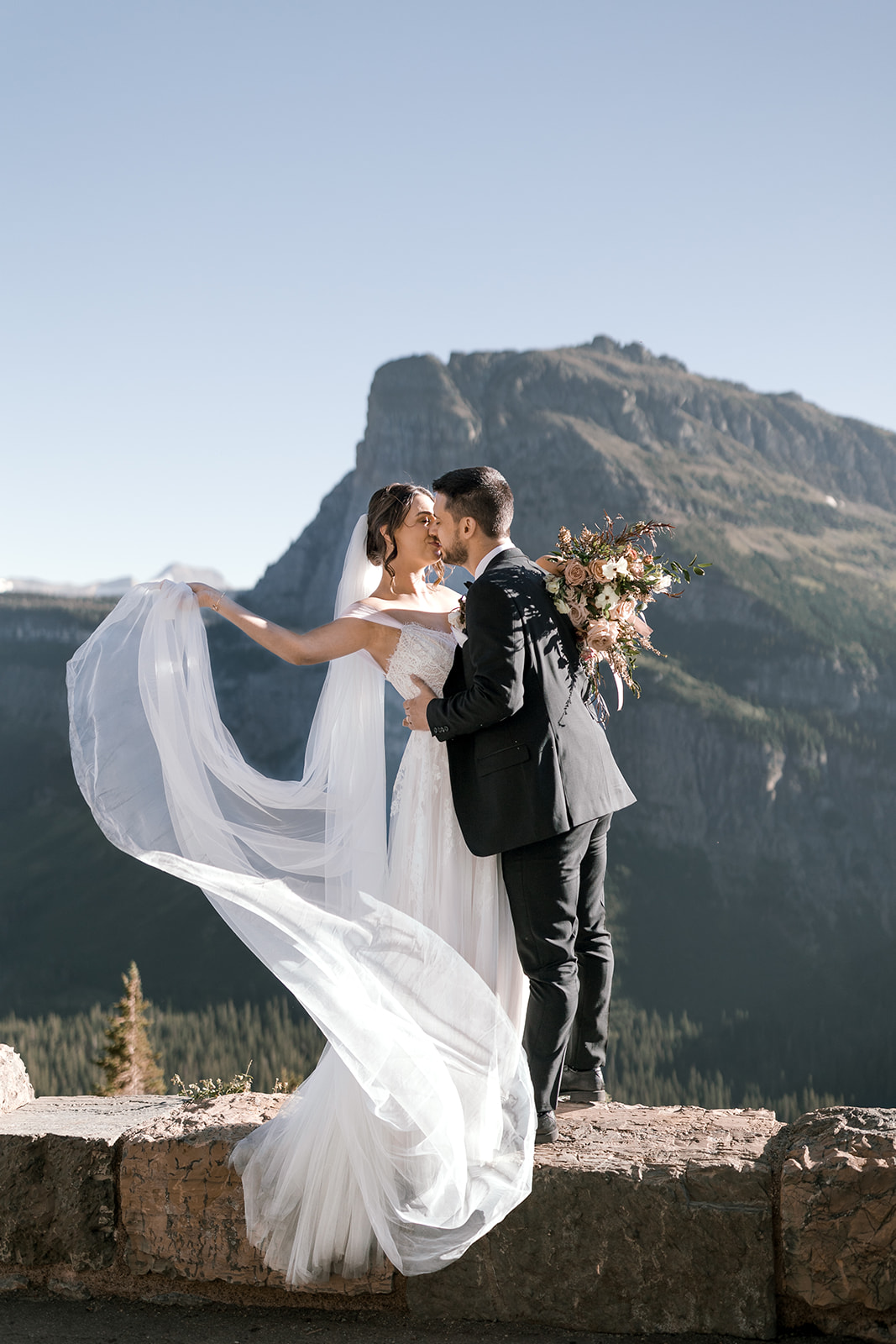 Bride and Groom portraits in Glacier National Park after their Elopement